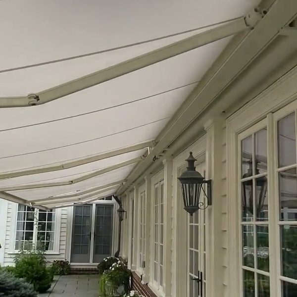 Long retractable awning on an estate home