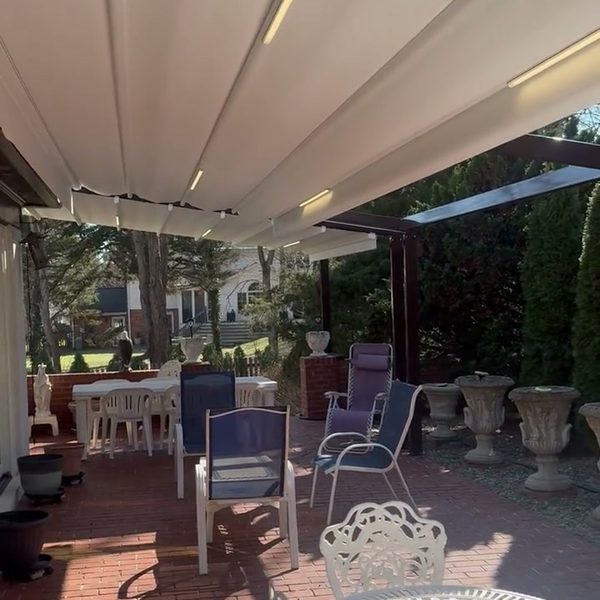 Retractable roof over a brick patio